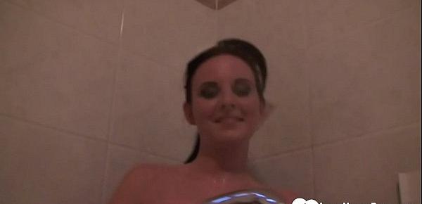  Desirable chick pleasures herself during her shower